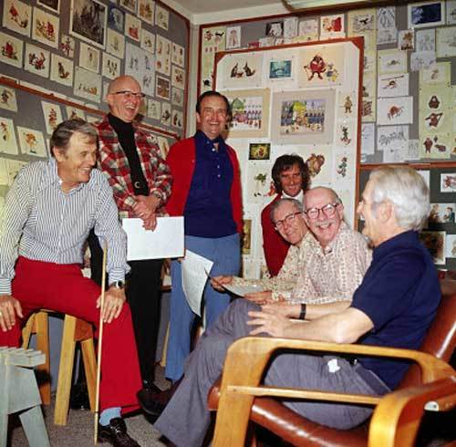 Woolie Reitherman (left side of photo — red pants) with a room full of Disney Legends working on 1973’s “Robin Hood.”