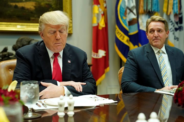 Republican US Senator Jeff Flake, right, pictured with Trump in December last year