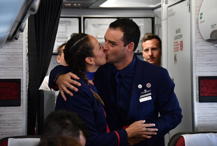 Crew members Paula Podest and Carlos Ciufffardi kiss after being married by Pope Francis during the flight between Santiago and the northern city of Iquique on January 18, 2018. 