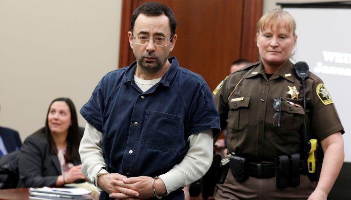 Larry Nassar is escorted by a court officer during his sentencing hearing in Lansing, Michigan, on Jan. 17, 2018.