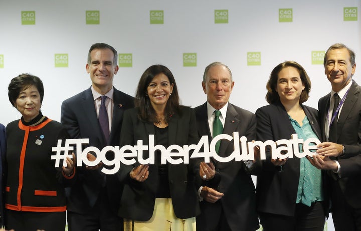 From left: Tokyo Gov. Yuriko Koike, Los Angeles Mayor Eric Garcetti, Paris Mayor Anne Hidalgo, New York Mayor Michael Bloomberg, Barcelona Mayor Ada Colau and Milan Mayor Giuseppe Sala pose during C40 Cities Climate summit in Paris on Oct. 23, 2017.