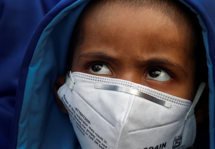A child wearing a face mask in Delhi. 