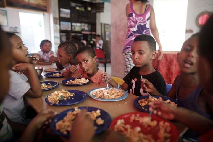 The children of African Eritrean migrants eat lunch at a makeshift kindergarten in southern Tel Aviv in September 2017. Tens of thousands of Africans who fled misery at home for safety in Israel are living in limbo, fearing deportation though some have lived in the country for more than a decade.