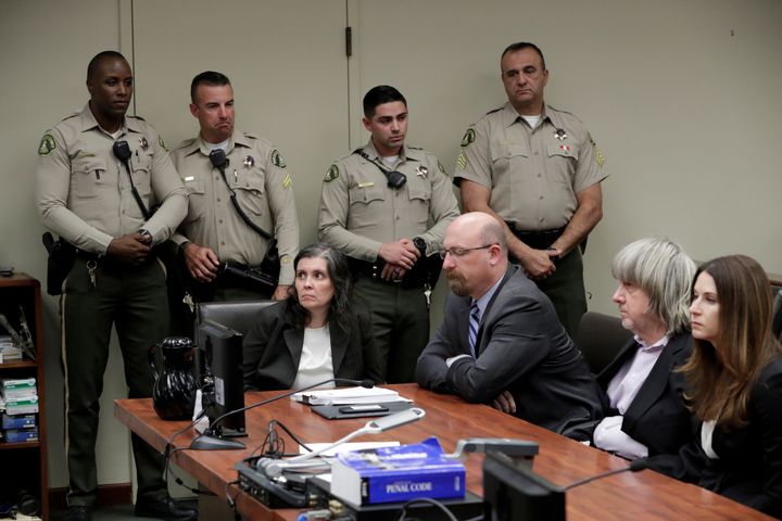 David Turpin, second from right, and his wife, Louise, far left, as their arraignment
