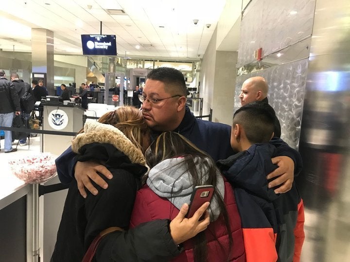 Jorge Garcia, 39, of Lincoln Park, Michigan, hugs his wife, Cindy Garcia, and their two children Jan. 15, 2018, at Detroit Me