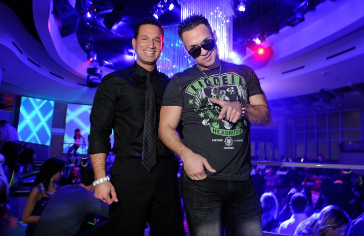 Marc Sorrentino, left, and Mike "The Situation" Sorrentino, right, at a nightclub in Las Vegas on Feb. 14, 2012.