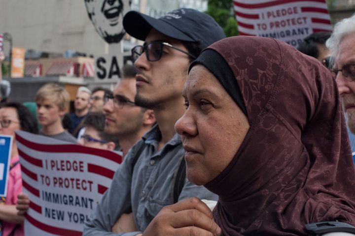 Immigrants join activists for an evening protest in Manhattan against the travel restrictions on Muslim-majority countries on June 29, 2017. 