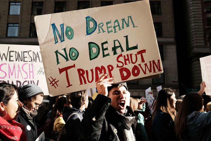 Thousands of people hold signs at New York Women's rally.