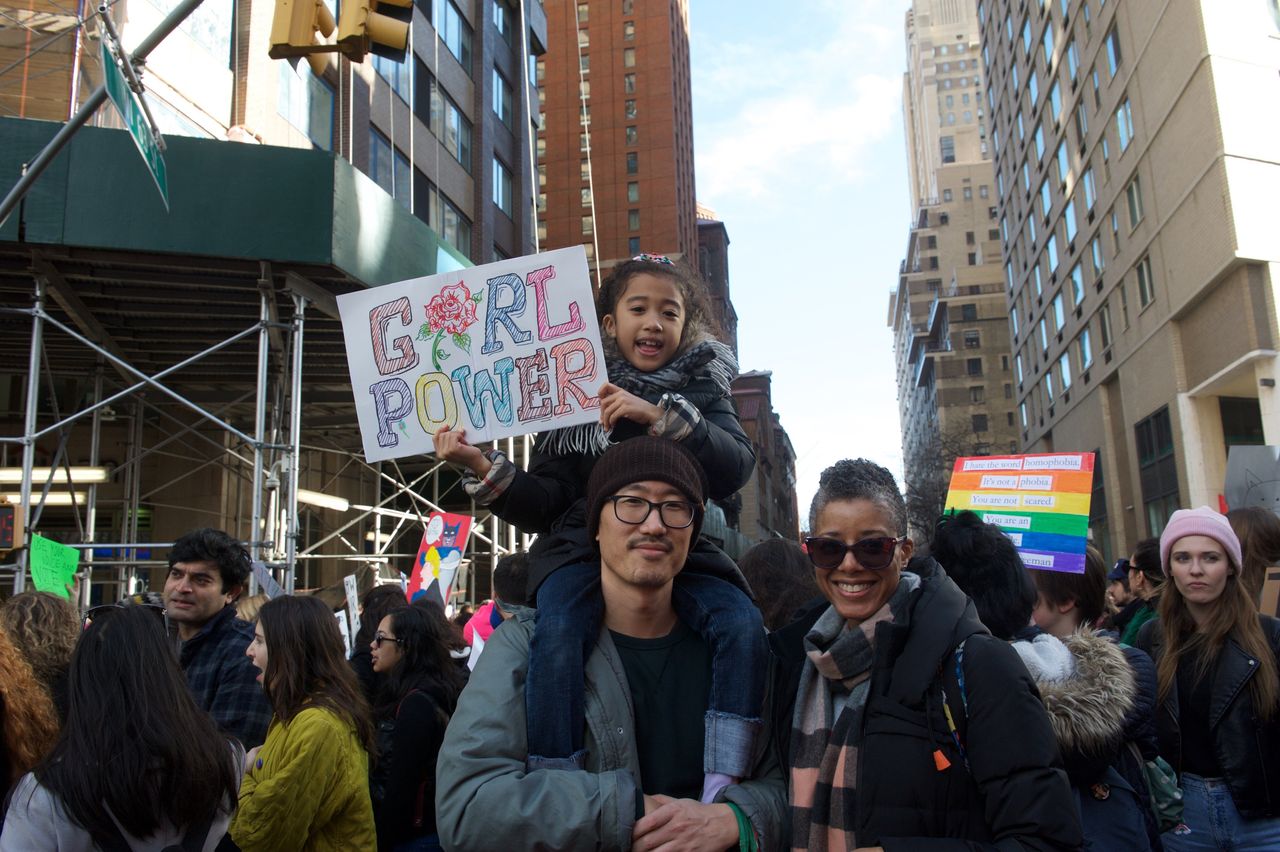 Marsha Annon, Yong Lee and their 7-year-old daughter at the NYC Women's March on Saturday.