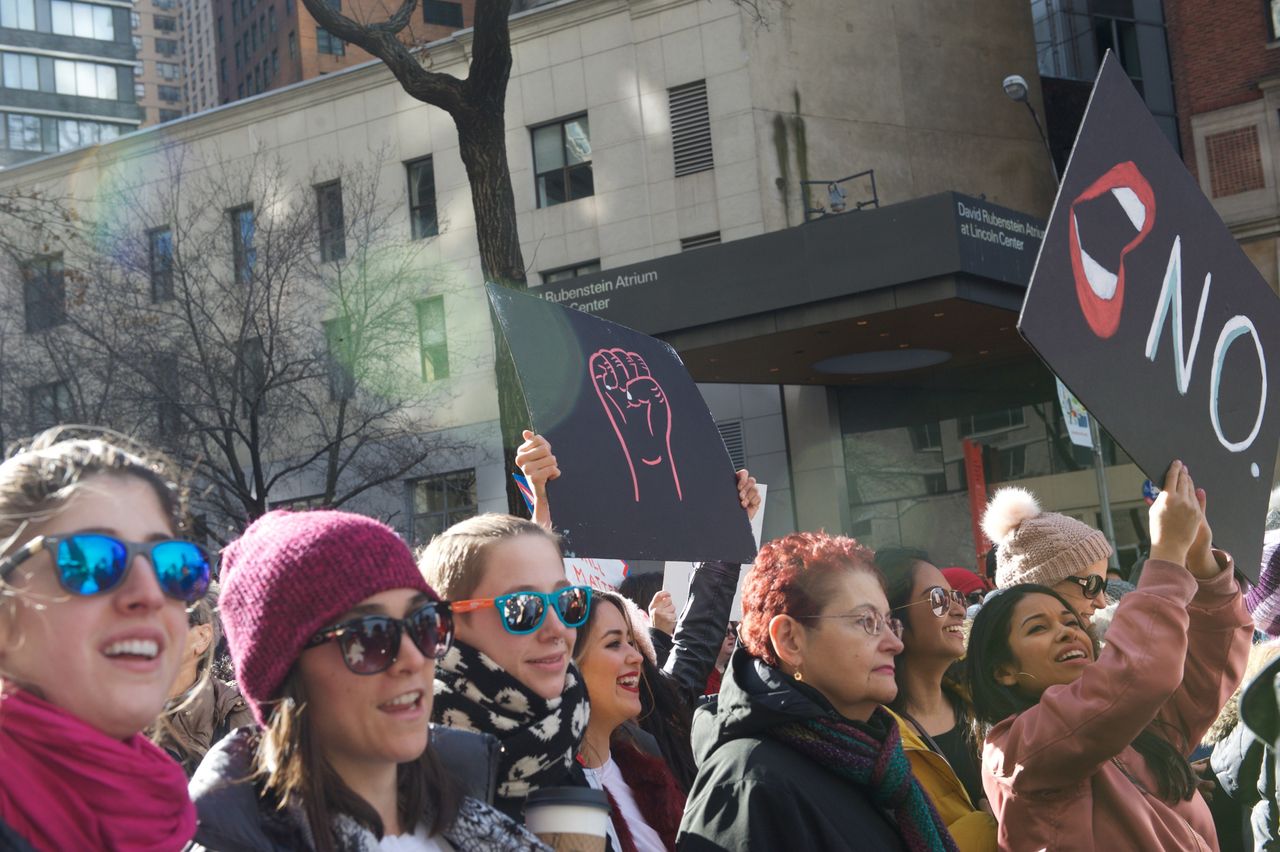 Marchers chant and hold up signs at the 2018 Women's March in New York City.