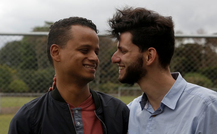 Roberth Castillo and Mario Arias speak after a news conference to announce the suspension of their wedding scheduled for Saturday, Jan. 20. 