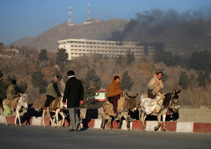 Smoke rises from the Intercontinental Hotel during an attack in Kabul, Afghanistan, January 21, 2018. (REUTERS/Mohammad Ismail)