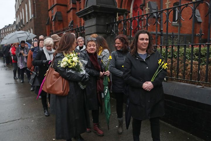 People queue to pay their respects to Cranberries singer Dolores O'Riordan at St Joseph's Church in Limerick, Ireland, during a public reposal.