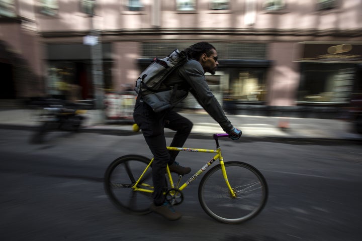<strong>A bike messenger rides through New York. </strong>