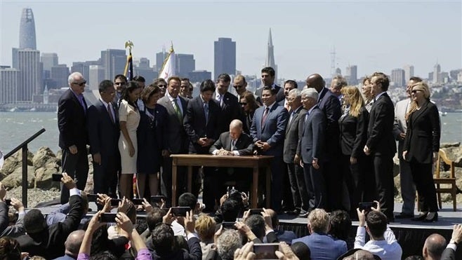 California Gov. Jerry Brown, a Democrat, signs legislation in 2017 renewing California’s cap-and-trade system. Brown is one of President Donald Trump’s most outspoken opponents on environmental issues.