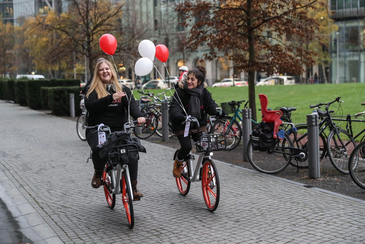 Staff members of Chinese bike-sharing company Mobike ride some of the company's 700 bicycles as it launches service in Berlin on Nov. 21, 2017.
