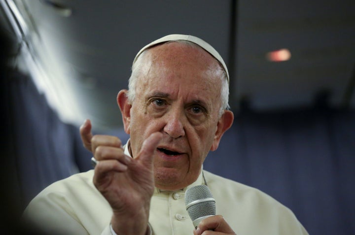 Pope Francis gestures during a Jan. 22 news conference during his flight back from a trip to Chile and Peru.