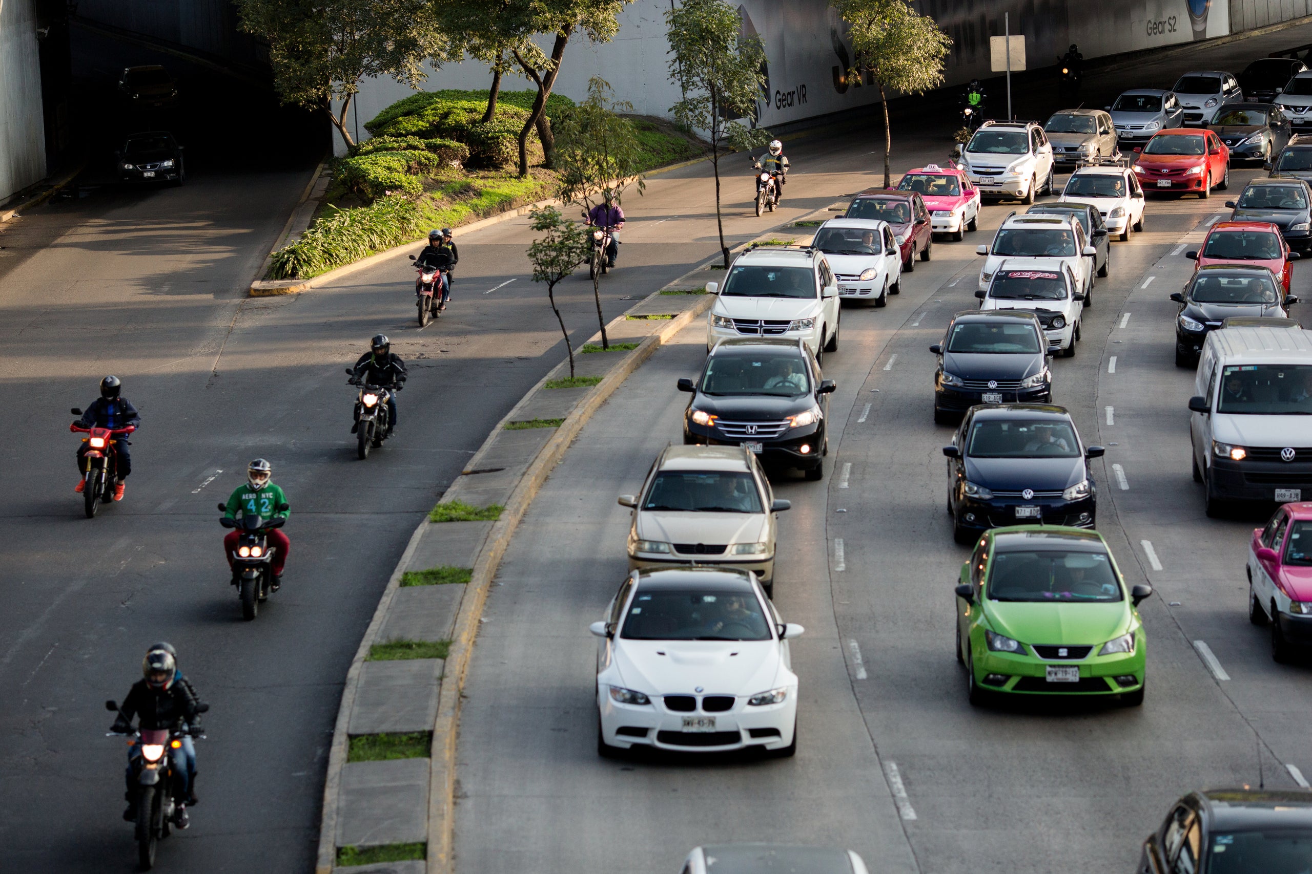 Vehicles move through traffic during morning rush hour on the Circuito Interior in Mexico City. More than 7 million people co