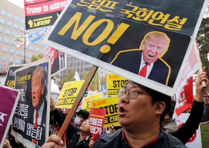 Protesters gather near the South Korean National Assembly in Seoul, where Trump spoke in November.