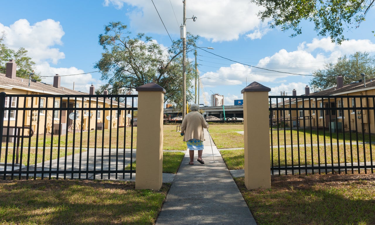 Marita Wilson, who is often troubled by asthma, walks to her home in Griffin Park.