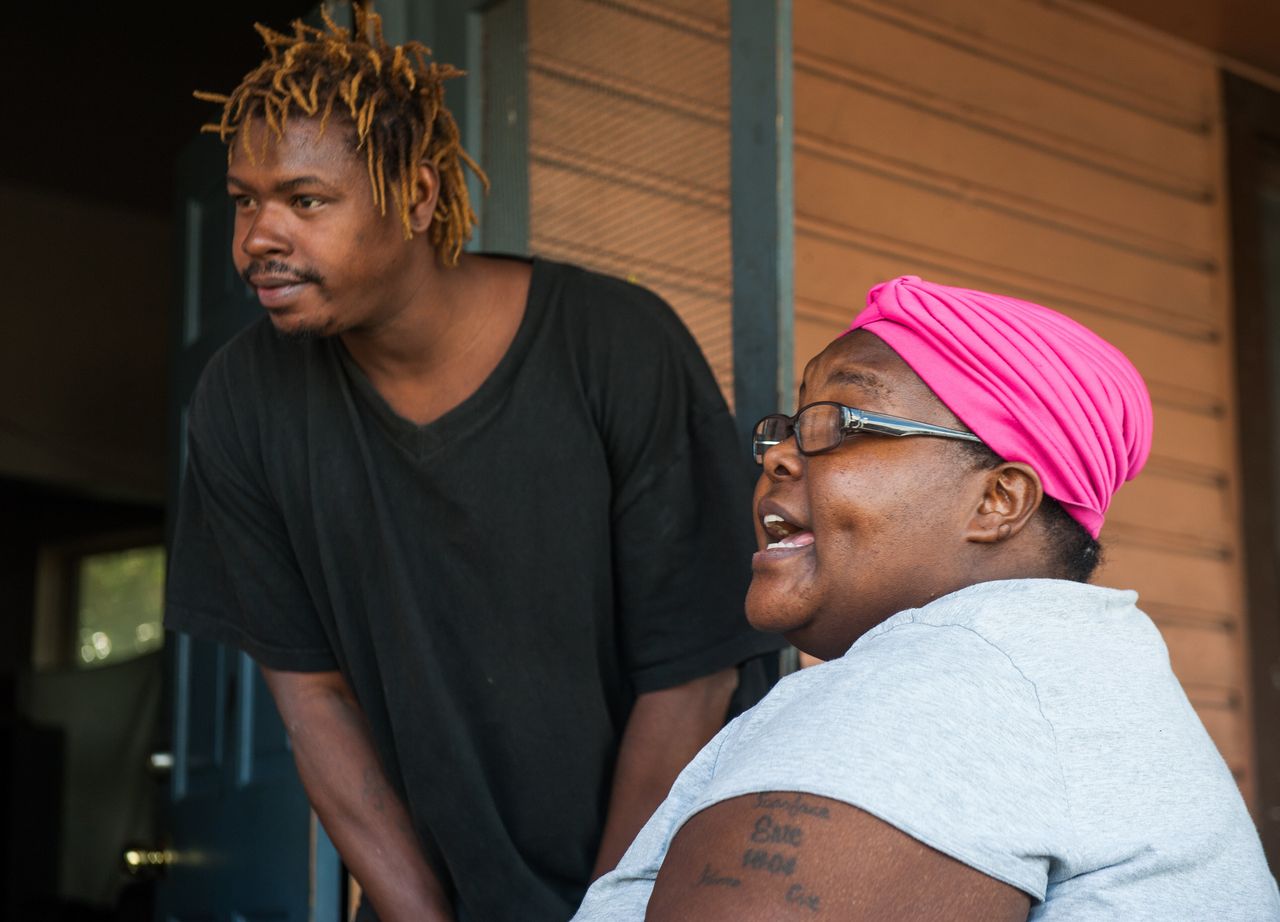 Allen and Latoya Lee talk on the porch of their Parramore home in November 2017. 