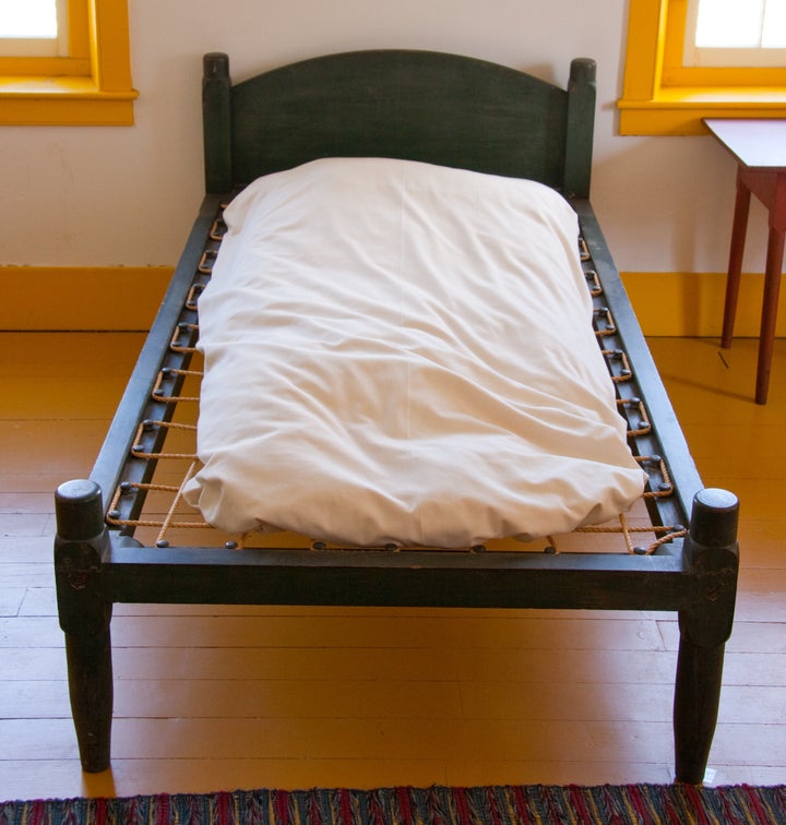 This antique Shaker-style bed uses a rope lattice support. 