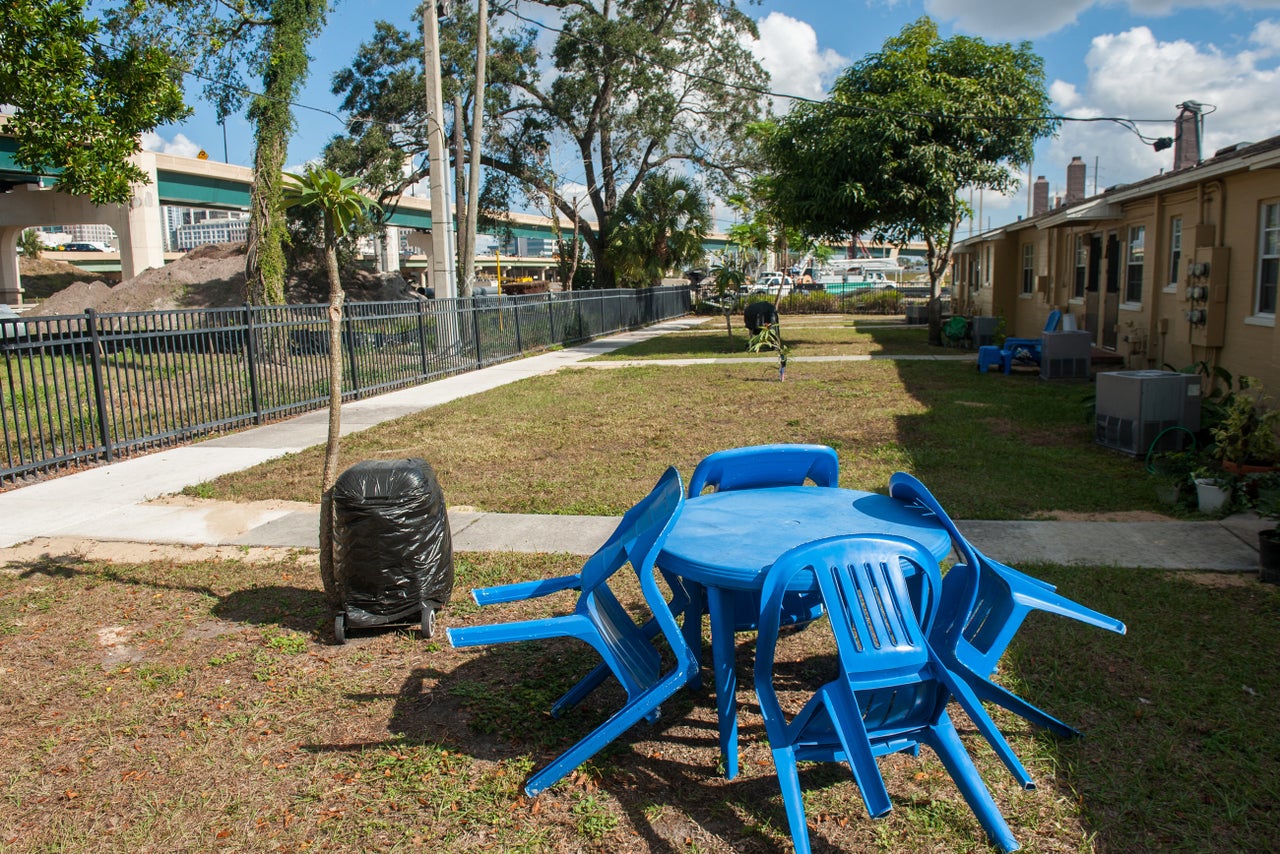 Backyards in the Griffin Park housing project look directly out at a highway.