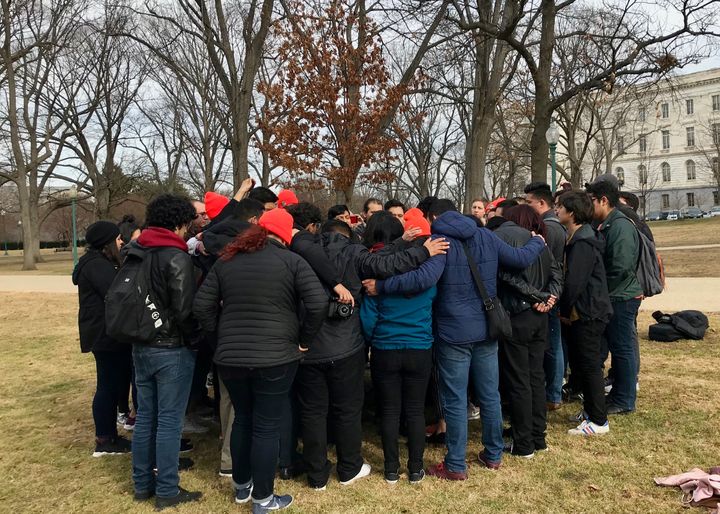 A group of Dreamer activists huddle after the Senate voted to move forward with a government funding bill even though it did not include immigration measures.