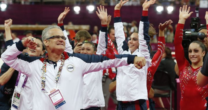 Geddert celebrates with USA Gymnastics team after the U.S. won gold for the artistic gymnastics event during the London games on July 31, 2012. 