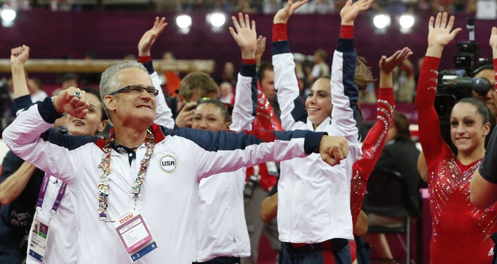 Geddert celebrates with USA Gymnastics team after the U.S. won gold for the artistic gymnastics event during the London games on July 31, 2012.