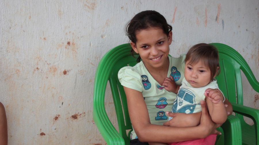 De Barros’ son Miguel was born with microcephaly. Here, the baby is held by de Barros’ daughter Juliana, age 12.
