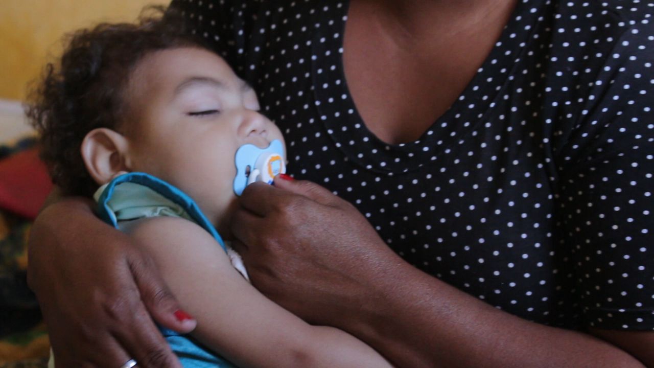 Silva holds Gabriel, 2, who was born with congenital Zika syndrome.