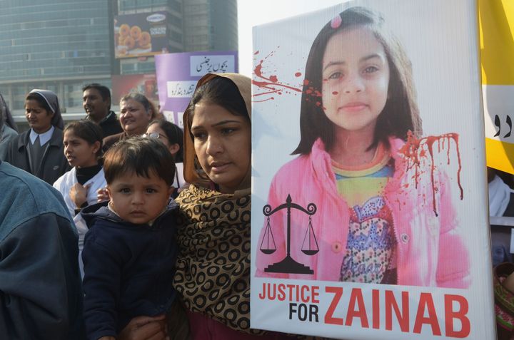 Pakistani activists hold signs demanding "Justice for Zainab" after the 7-year-old was raped and murdered in Kasur.