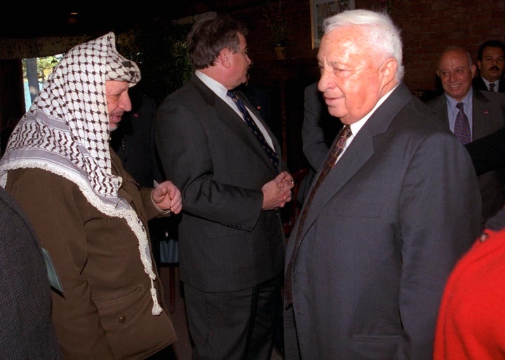 A story in The New York Times details former Israeli Prime Minister Ariel Sharon's (right) decades-long attempt to assassinate PLO leader Yasir Arafat (left).