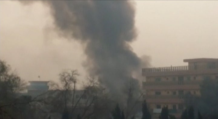 Smoke rises from a blast near the office of the Save the Children aid agency in Jalalabad, Afghanistan, on Wednesday.