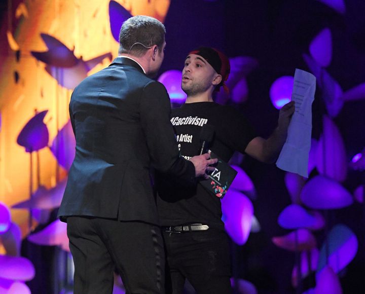 Dermot O'Leary confronts a stage invader during the NTAs