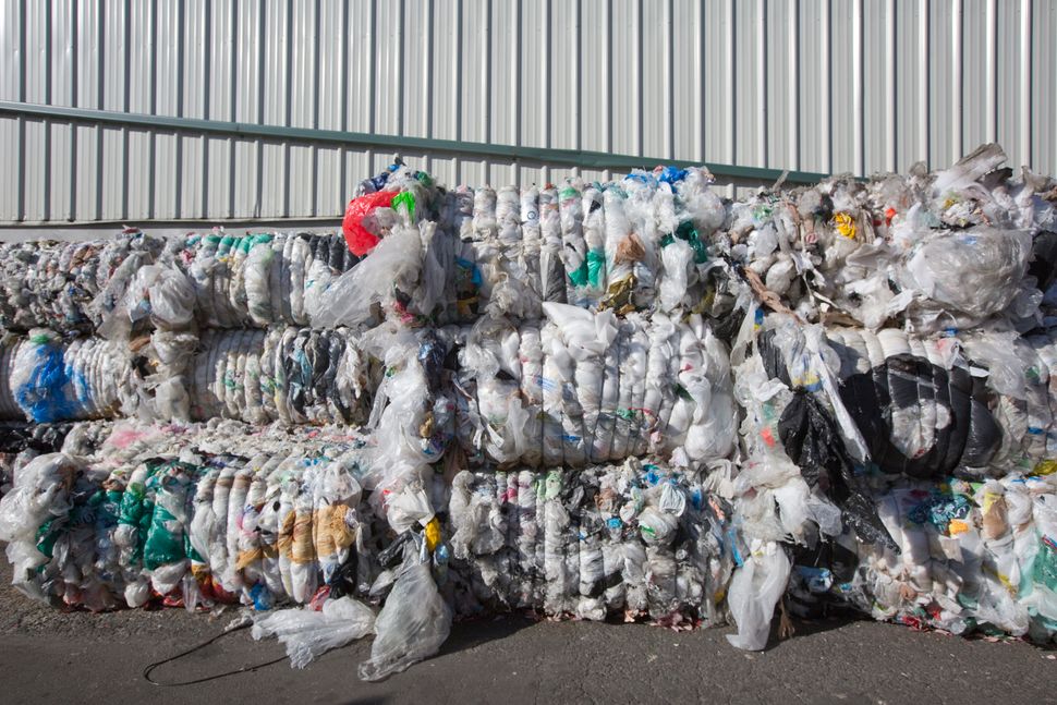 Compressed blocks of plastic waste, which would have been exported to China, pile up at Far West Recycling in Hillsboro, Oregon.