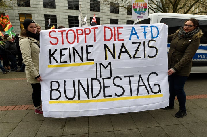 Protesters hold a sign reading "Stop the AfD. No Nazis in the German Parliament" in Hanover, Germany, December 2, 2017.