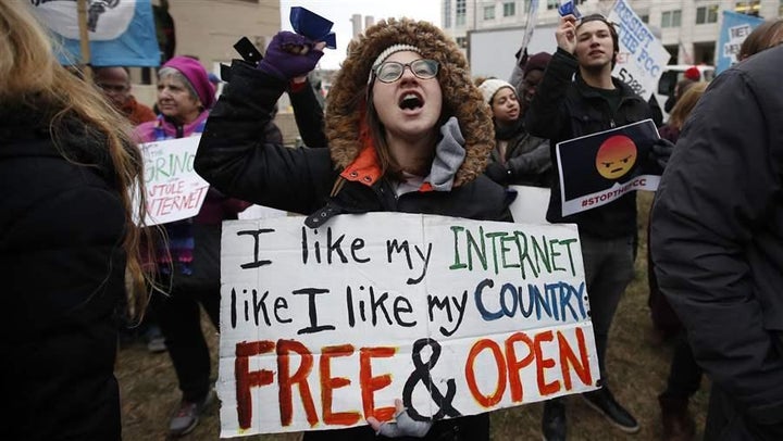 Lindsay Chestnut protests near the Federal Communications Commission in Washington, D.C., last month. The FCC voted to repeal net neutrality rules, prompting officials in a growing number of states to fight back with lawsuits and proposed legislation.