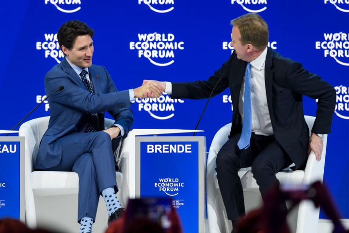 Trudeau shakes hands with WEF President Borge Brende on Tuesday.