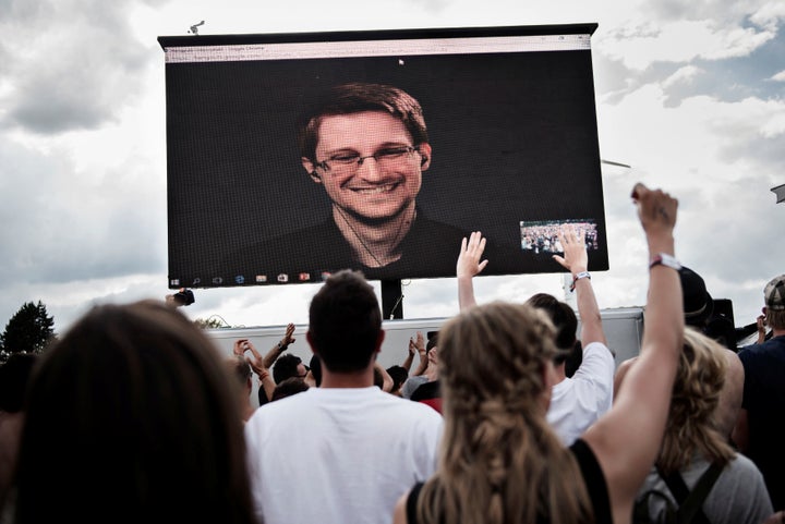 Edward Snowden, seen on a screen as he delivers a speech to a festival in Denmark, was forced to leave the U.S. after he leak