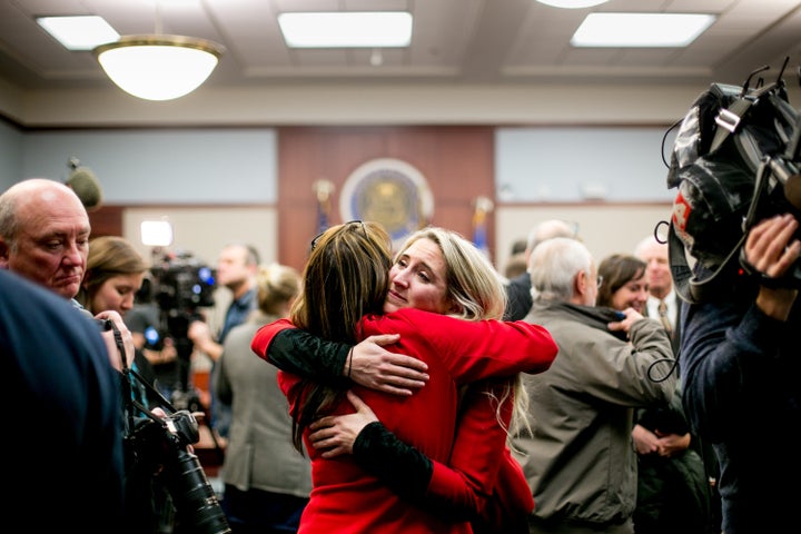Megan Halicek, a survivor of Larry Nassar's abuse, hugs a supporter after Nassar's sentencing in Ingham County Circuit Court