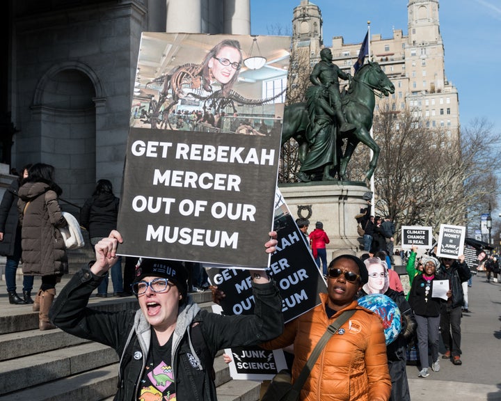 Protesters from the group Revolting Lesbians hold placards and chant slogans outside New York City's American Museum of Natural History on Jan. 21, 2018.