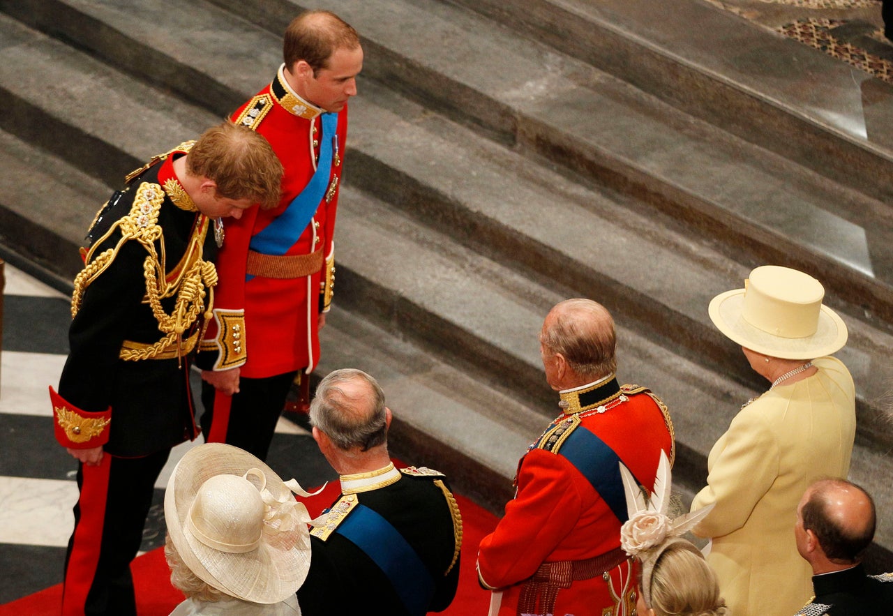 Prince Harry and Prince William bow before the Queen at the wedding Prince William and Kate Middleton