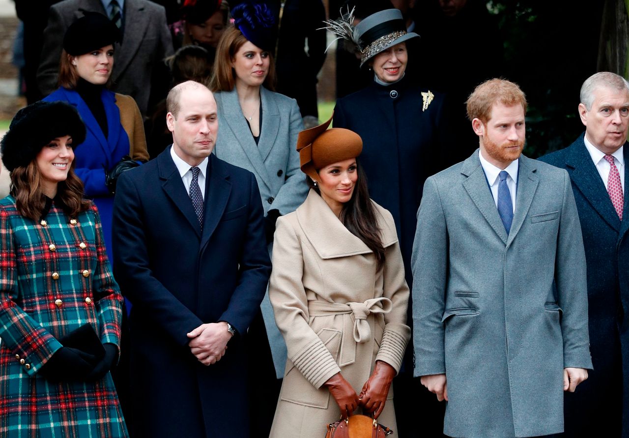Meghan Markle waits with members of the Royal Family as they wait to see off the Queen after attending the traditional Christmas Day church service at St Mary Magdalene Church in Sandringham