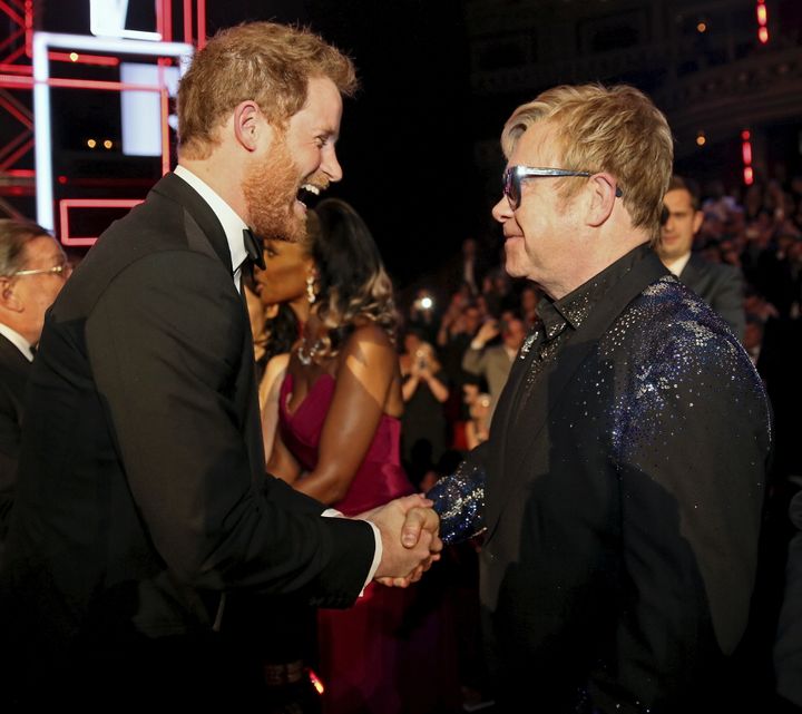 Prince Harry greets Elton John on Nov. 13, 2015. 