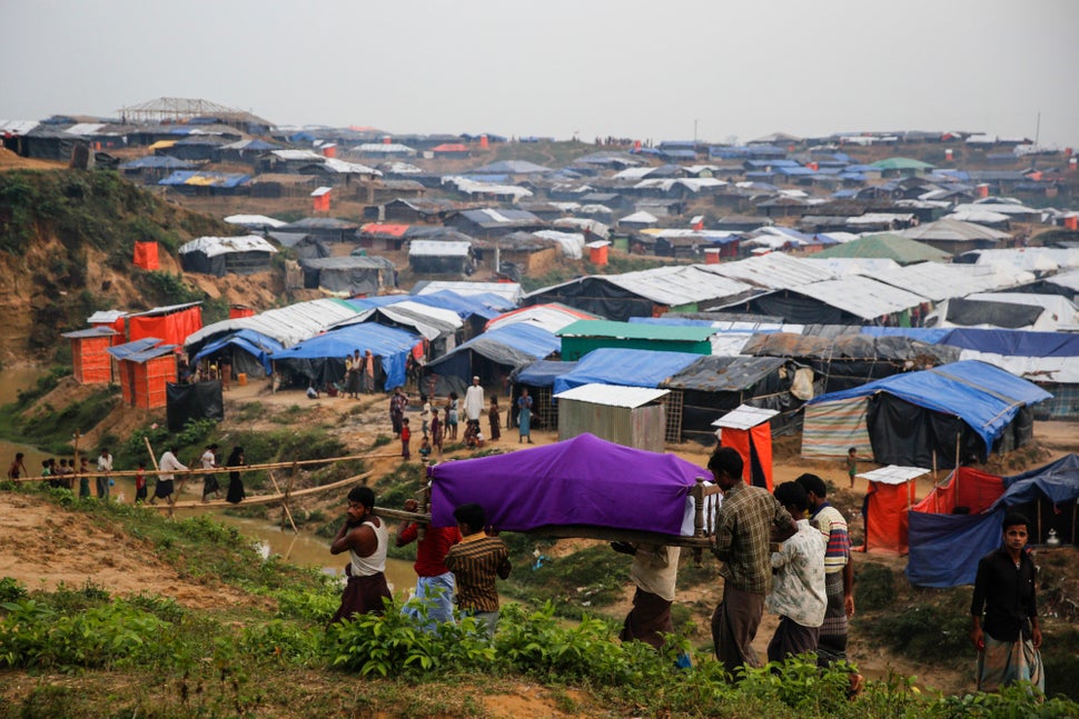 Men on their way to a funeral in Kutupalong, Bangladesh. 