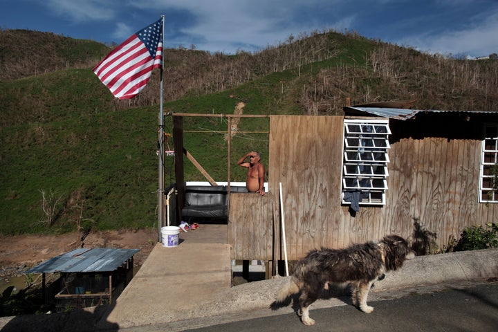 Ismael Rivera stands at his damaged house in San Lorenzo, Puerto Rico, on Oct. 4, 2017.