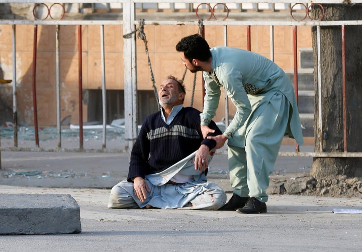 A man reacts after hearing his son was killed during a car bomb attack in Kabul, Afghanistan on January 27, 2018.