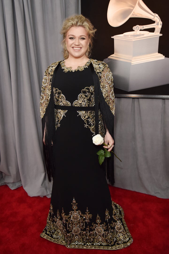 Kelly Clarkson carrying her white rose at the 60th annual Grammy Awards on Jan. 28.